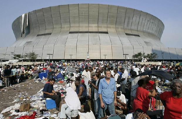 Thousands of Hurricane Katrina survivors wait to be evacuated from the Superdome in New Orleans September 2, 2005. After five days of surviving Hurricane Katrina, New Orleans residents were finally evacuated from the sports stadium by authorities. REUTERS/Jason Reed